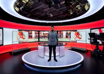 Male broadcast engineer in studio