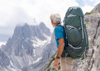 Man backpacking near the Cadini di Misurina in the Italian Dolomites