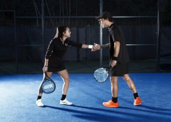 Woman and man rejoice during a padel match (Ph: Emanuela D'Ambrosi)