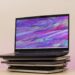 Gaming laptop on top of stacked laptops